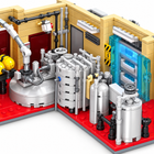 Close-up of the modular chemistry lab set showing the silver reaction tanks, pipes, red floor, tan walls and blue transparent cold-storage doors.