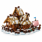 Viking longhouse building block set back view with snowy thatched roofs, log walls, dock and striped longship