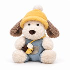 Plush puppy with yellow beanie, blue overalls and bee bag, front view