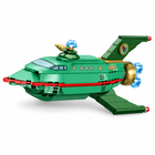 Close-up of the detachable green brick-built space shuttle with red lower stripe, canopy, swept fins, gold engine housing, and blue translucent engine elements.