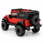Crimson Crawler red brick-built SUV, rear three-quarter view with spare tyre