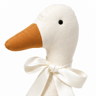 Cream white fabric goose plush macro close-up of the head, beak and satin ribbon bow