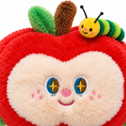Close-up of the apple plush charm face: embroidered star eyes, pink nose, smile and soft plush texture