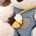 Plush puppy macro close-up of the bee shoulder bag and checked denim pocket