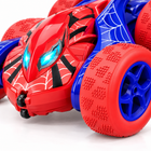 Close-up of the Double-Sided Flip 4WD RC Car with glowing blue headlights and a deep-tread red tyre