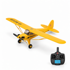 XK A160 RC airplane with its remote controller on a white studio floor