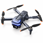 Three-quarter view of the dark folding 1080P camera drone with blue lights and orange-tipped propellers.