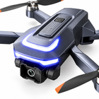 Close detail of the 1080P droneโs front camera and blue LED on its charcoal body.