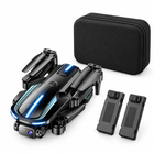 Folded black camera drone with carrying case and two modular batteries
