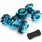 2-4ghz-4wd-gesture-sensing-rc-stunt-car-double-sided-led-toy: distinct supporting studio angle.
