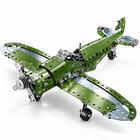 Assembled 285-piece green perforated metal airplane model on white.