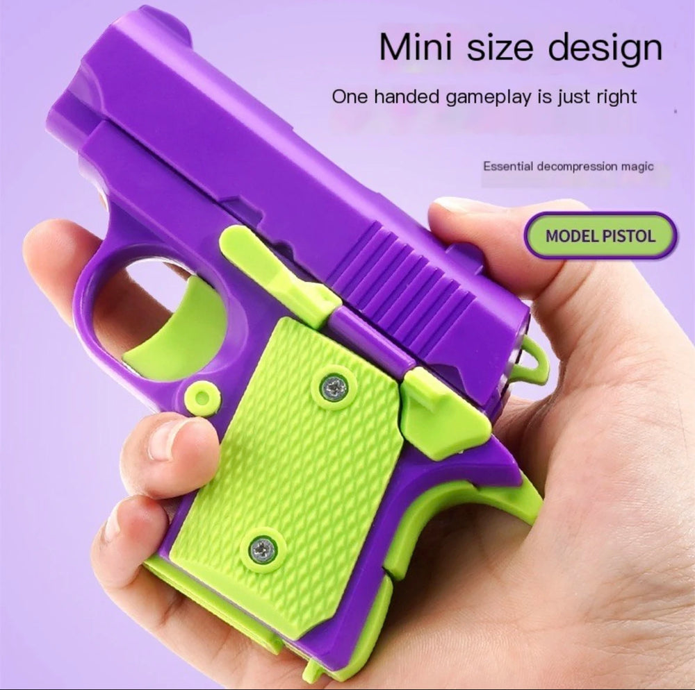 Hand holding Toylvia Mini 1911 purple fidget toy gun – compact ABS plastic stress relief design.