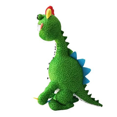 Side view of green Pianosaurus plush toy with piano-teeth smile and blue back spikes