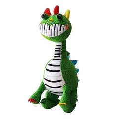 Sitting green Pianosaurus plush toy with piano-teeth smile and colorful horns