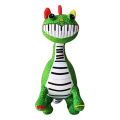 Standing green Pianosaurus plush doll with piano-teeth smile and colorful horns