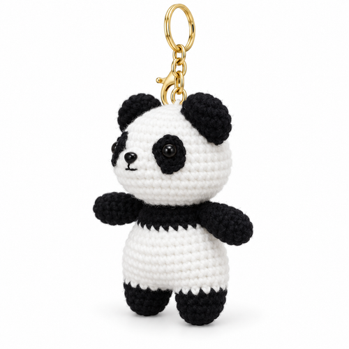Panda crochet keychain, centered left-facing three-quarter studio photo