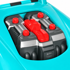 Close-up of removable gray engine and red bolts in teal mechanic toy