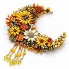939-piece golden moon flower building block wall decor lying flat, showing the depth of the brick flowers and bead tassels