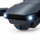 Close-up of the foldable droneโs front camera pod and lens