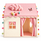 Front view of pink gingham play tent with tied curtains, window and empty interior