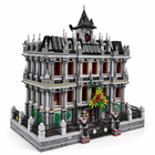 Gothic psychiatric hospital building-block model, full three-quarter hero with clock tower, iron fence, and colorful entrance detail