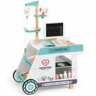 Green and white wooden medical trolley with toy monitor, IV stand and medical accessories.