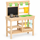 Wooden mud kitchen with green basins, yellow water tank and garden tools, three-quarter view