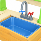 Close-up of the blue removable basin and gray faucet with red and blue knobs.