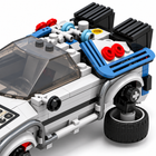 Macro close-up of the rear deck machinery, blue tubing, red details, and wheel of the 1:24 Time Machine MOC car