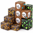 Close-up of the Dark Castle magnetic cubes showing skull, green ore and gold cracked stone printed textures.