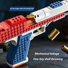 A toy gun-shaped building block set shown in close-up with text callouts explaining trigger pull and mechanical linkage shell throwing. The product is primarily red, white, and blue with gold-colored toy shells floating around it on a dark tabletop background.