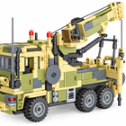 Close detail of the military building-block crane truck's boom, pivot, cable and six-wheel chassis.