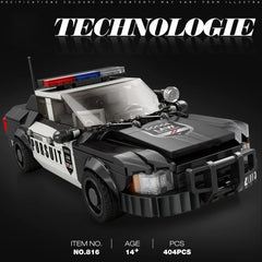 Toy police car model with 'Technologie' branding on a dark background