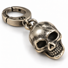 Close-up of the skull pendant on the dark punk keychain showing teeth and eye sockets