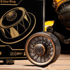 Adult hand holding the center cap between thumb and index finger while flicking the Star Ring metal spinner into motion.