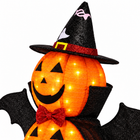 Close-up of the pumpkin Halloween light top: witch hat, glowing jack-o-lantern face and red bow