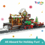 Toy train set with a station and festive decorations on a white background, featuring the brand 'Toylivia Toys'.