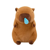 Front view of a brown snot capybara plush toy with blue snot on a white background