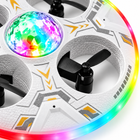 Close-up of the RC UFO drone's faceted multicolor LED dome, guarded rotor, shell markings, and illuminated rim.