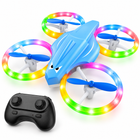 Light blue kid-safe RC drone, three-quarter-left studio view with controller.