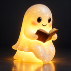 Cute ghost reading lamp glowing warm with sparkles on a dark background
