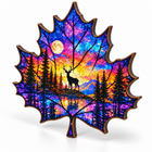Autumn maple leaf wooden jigsaw puzzle with deer, forest and sunset artwork, angled view