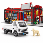 White service pickup truck and tan dog in front of the red vehicle service garage building block set.