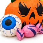 Close-up of the inflatable blue eyeball, pink wrapped candy and jack-o-lantern face fabric detail
