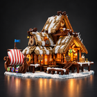Viking longhouse building set glowing with warm LED lights on a dark studio background