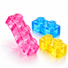 Close-up of a soft translucent pink jelly brick bending to show its squishy flexible material