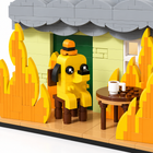 Close-up of yellow brick dog figure and coffee table in burning house block set - Toylvia