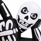 Close-up of the 7FT inflatable skeleton skull with red-ringed eyes, teeth and printed bones on black fabric