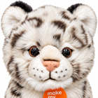 Close-up of the snow leopard plush face: amber eyes, pink nose and soft spotted fur