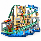 Castle roller coaster building-block model, front view with green track, red train and blue water base